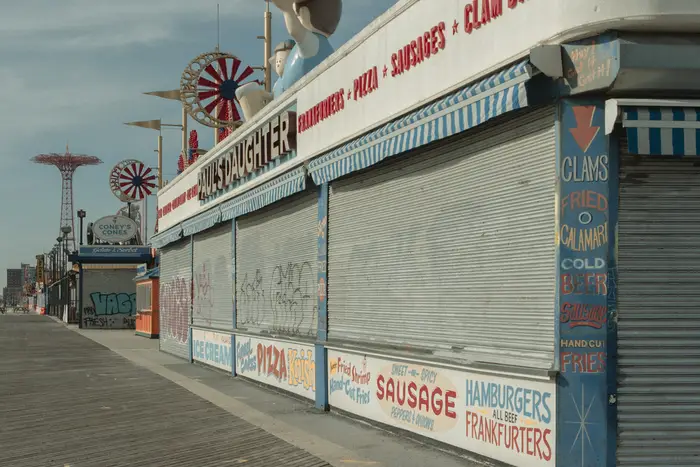 a closed-up restaurant on the Coney Island boardwalk in the winter
